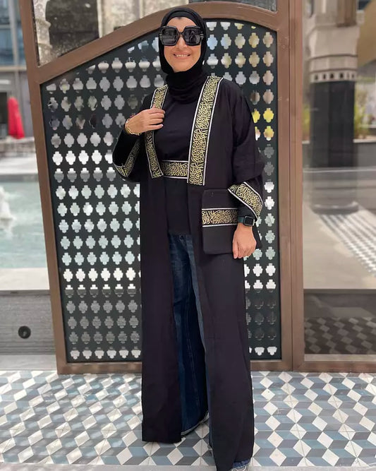 black linen kaftan with gold calligraphy