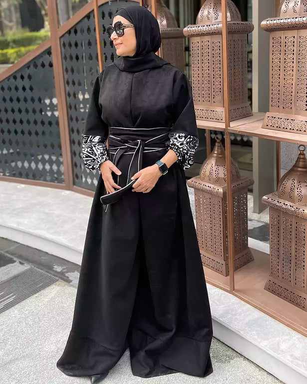 Suede jumpsuit with kuffi calligraphy