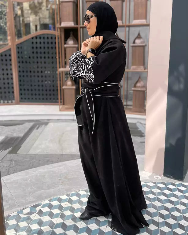 Suede jumpsuit with kuffi calligraphy