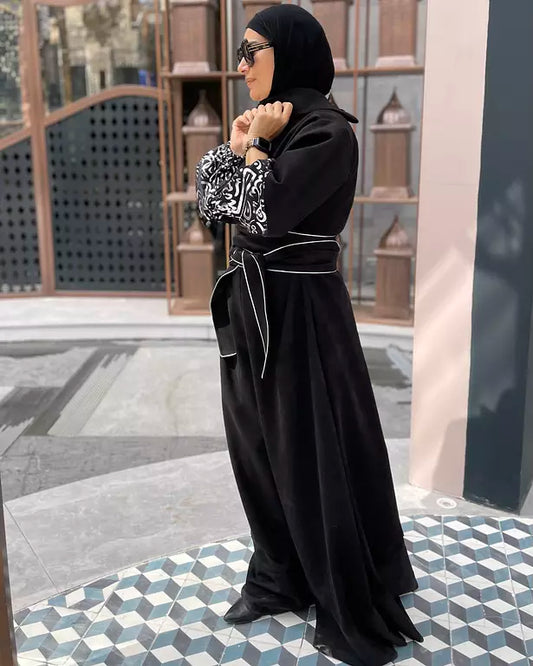 Suede jumpsuit with kuffi calligraphy
