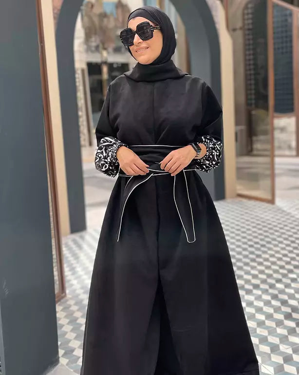Suede jumpsuit with kuffi calligraphy