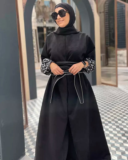 Suede jumpsuit with kuffi calligraphy