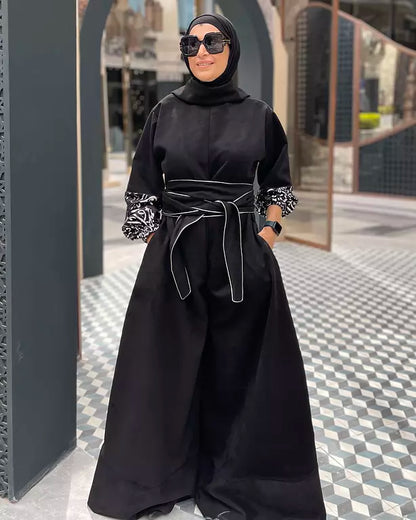 Suede jumpsuit with kuffi calligraphy