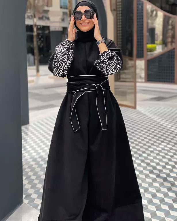 Suede jumpsuit with kuffi calligraphy