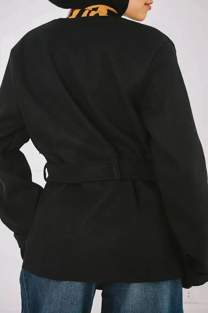 Short jacket with belt and pin in black