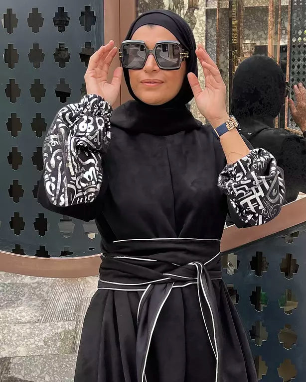 Suede jumpsuit with kuffi calligraphy